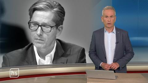 Moderator vor Bild mit Topthema