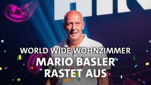 Mario Basler schmunzelt erschöpft. Text: World Wide Wohnzimmer - Mario Basler rastet aus