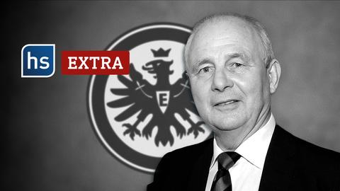 Eintracht-Legende und 74er-Weltmeister Bernd Hölzenbein vor dem Logo der Frankfurter Eintracht. Branding: hessenschau extra