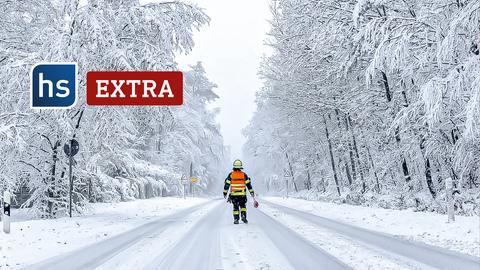 Schneefall und Schneebruch im Taunus Ein Feuerwehrmann sperrt die Landstraße in Richtung Feldberg.