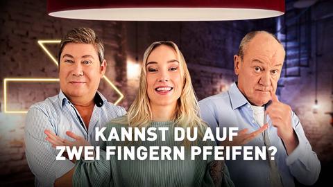Das Rateteam aus Jacky Feldmann, Sascha Korf, Bodo Bach mit der Frage 'Kannst du auf zwei Fingern pfeifen?'